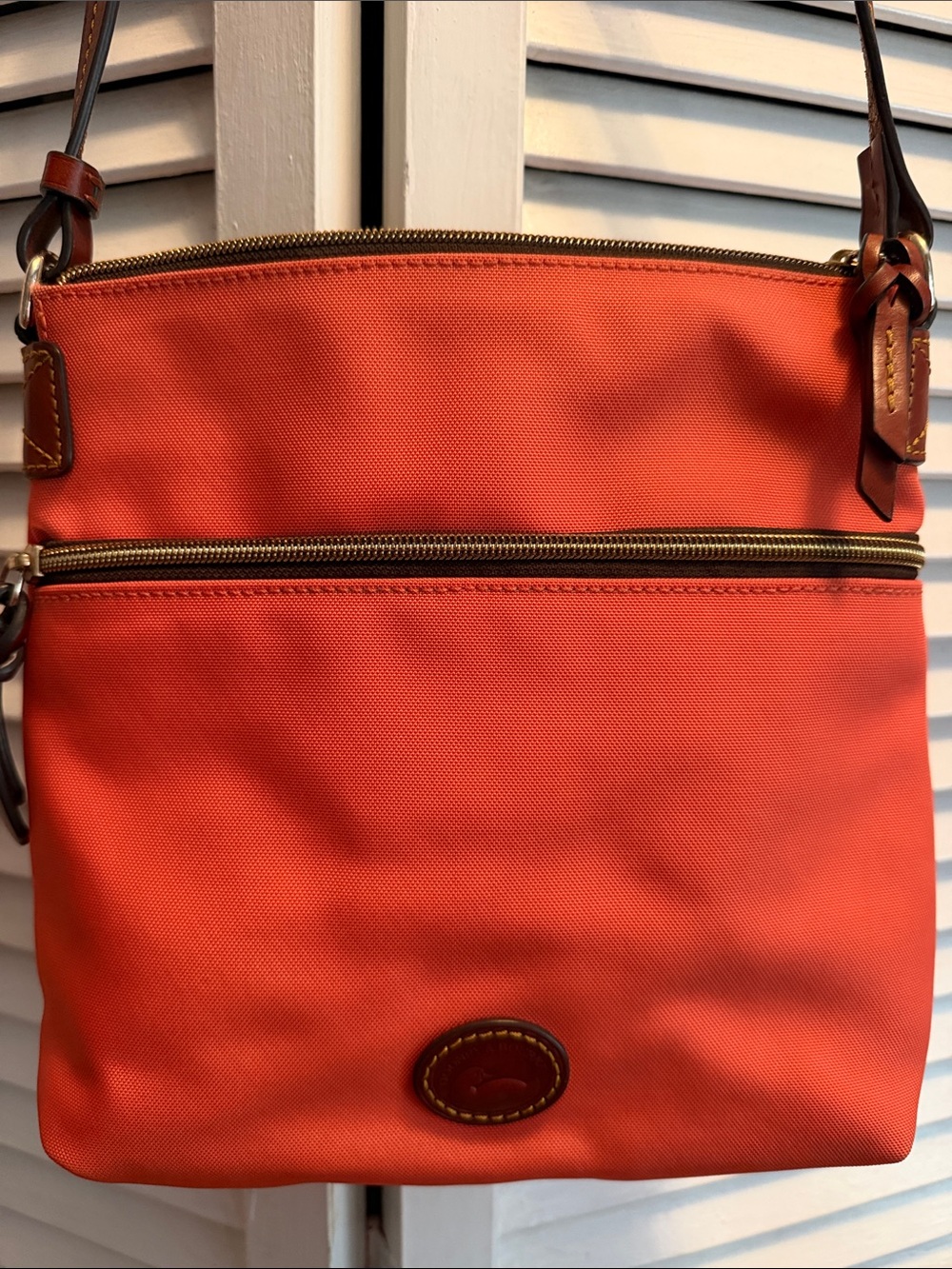 Dooney & Bourke Orange Crossbody with Brown Trim and Adjustable Strap